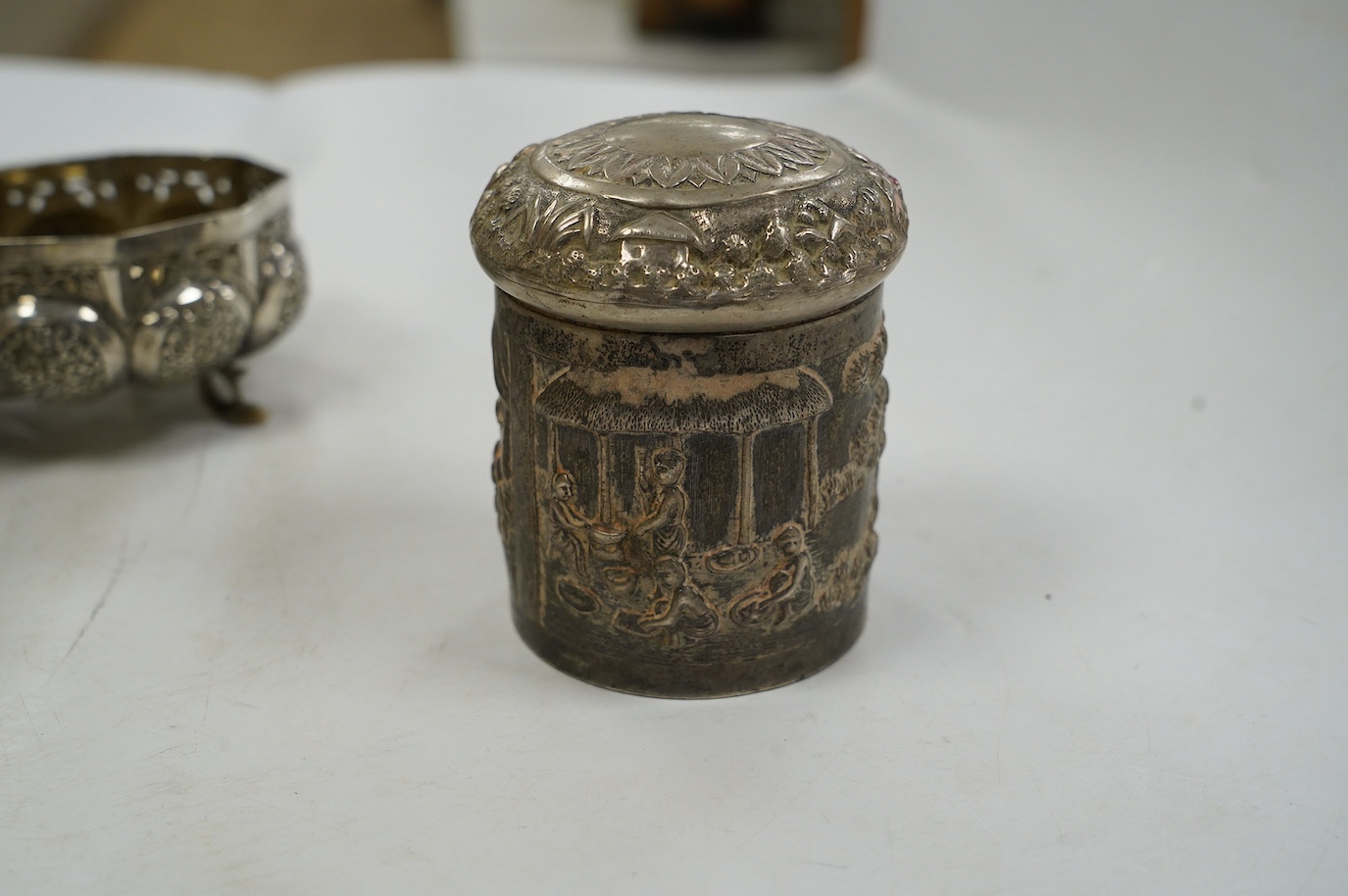 A pair of Indian pierced cusped white metal bowls, diameter 84mm, three other Indian white metal canisters and a Middle Eastern pill box. Condition - fair